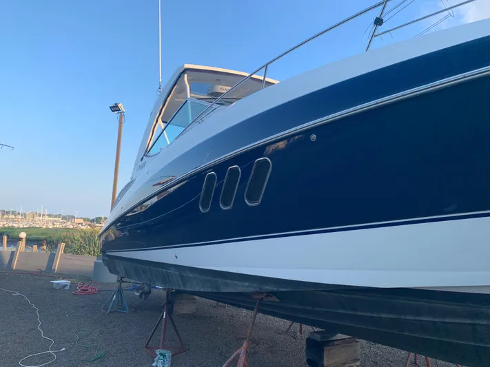 Knot A Care Yacht Photos Pics 2015 Cruisers Yachts 350 Express on dry dock, side view.