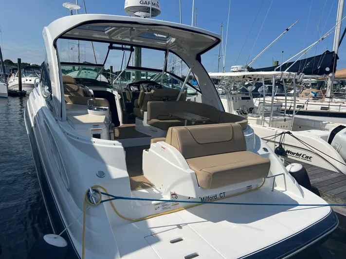 Knot A Care Yacht Photos Pics 2015 Cruisers Yachts 350 Express docked, featuring spacious seating and sleek design.