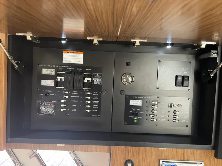 Knot A Care Yacht Photos Pics Electrical panel of 2015 Cruisers Yachts 350 Express with switches and controls.