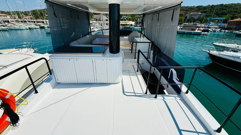  Yacht Photos Pics Azimut Magellano 60 yacht deck, 2025 model, docked in a marina with scenic views.