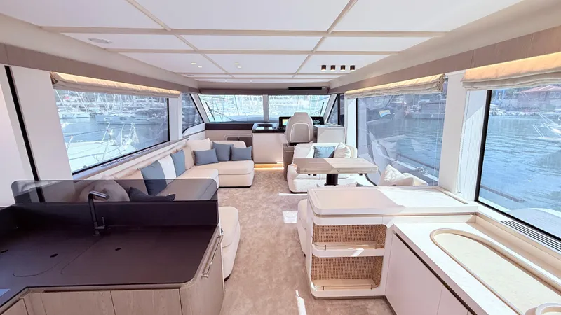 Yacht Photos Pics Luxurious interior of 2025 Azimut Magellano 60 yacht with modern furnishings and large windows.