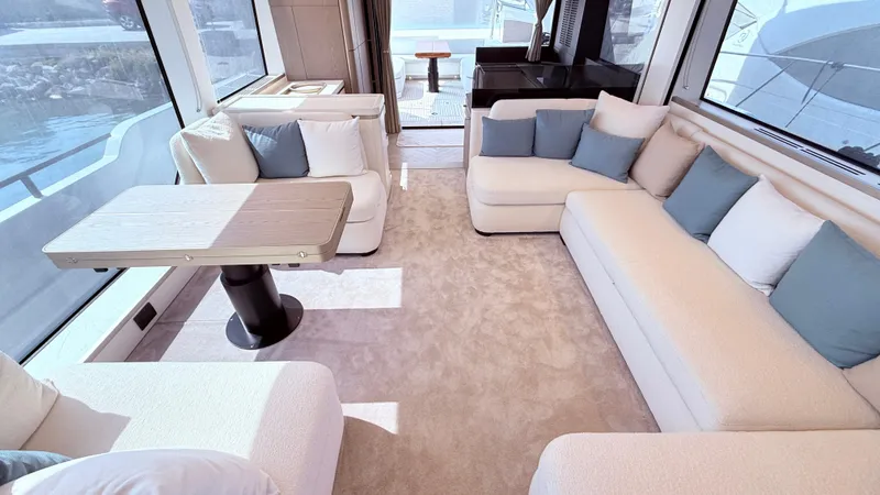  Yacht Photos Pics Luxurious interior of 2025 Azimut Magellano 60 yacht with plush seating and elegant decor.