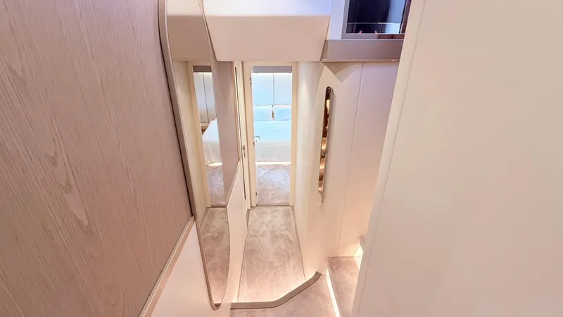  Yacht Photos Pics Luxurious interior hallway of 2025 Azimut Magellano 60 yacht, featuring modern design and elegant finishes.