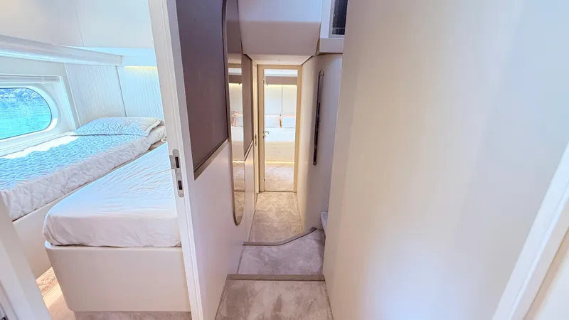  Yacht Photos Pics Luxurious interior of 2025 Azimut Magellano 60 yacht, featuring elegant bedroom and hallway.