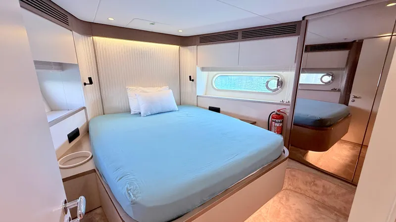  Yacht Photos Pics Luxurious bedroom interior of 2025 Azimut Magellano 60 yacht with modern design.