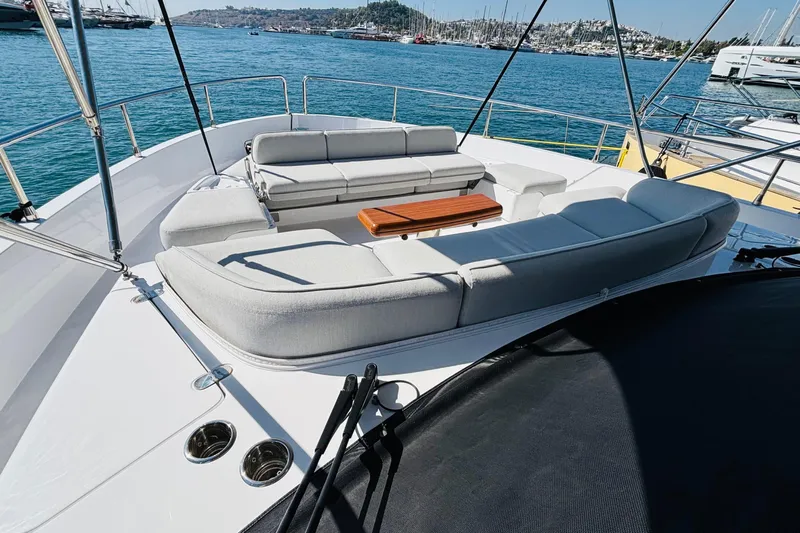  Yacht Photos Pics Luxurious 2025 Azimut Magellano 60 yacht deck with elegant seating and ocean view.