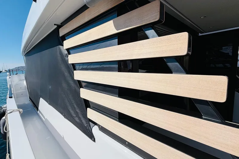  Yacht Photos Pics 2025 Azimut Magellano 60 yacht with sleek wooden panel design on deck.