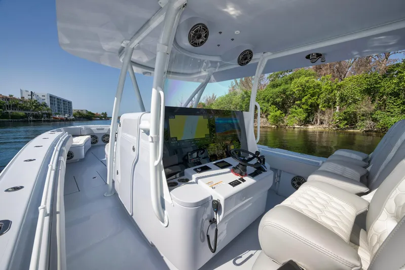 O'fishal Business Yacht Photos Pics 2025 Contender 44 ST boat interior with modern helm and seating.