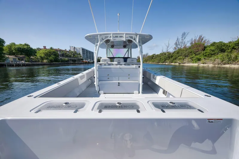 O'fishal Business Yacht Photos Pics 2025 Contender 44 ST boat on calm water, showcasing spacious deck and sleek design.