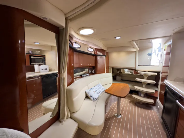  Yacht Photos Pics Luxurious interior of 2005 Sea Ray 340 Sundancer yacht with elegant seating and modern amenities.