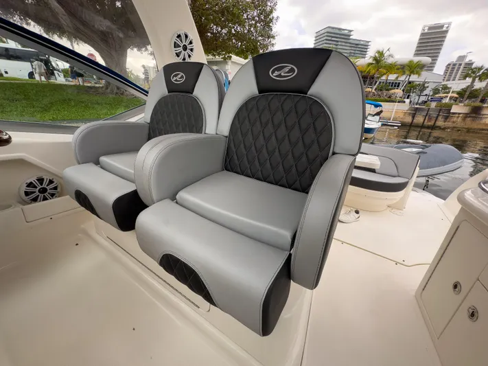  Yacht Photos Pics Luxury seating on 2005 Sea Ray 340 Sundancer boat, featuring sleek design and waterfront view.