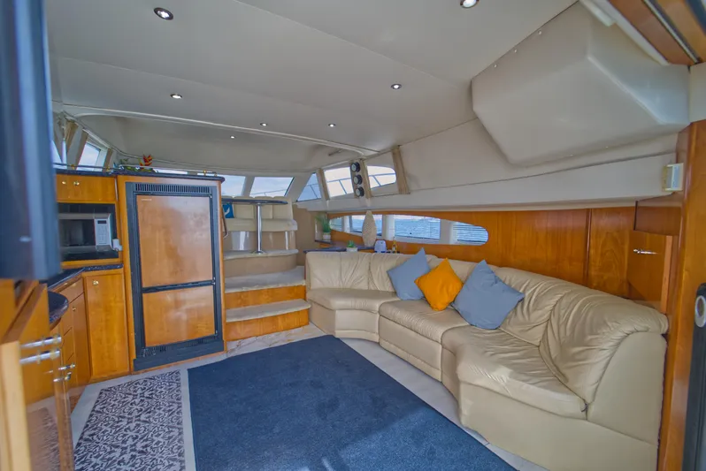  Yacht Photos Pics Luxurious interior of a 2002 Carver 410 Sport Sedan with plush seating and modern amenities.