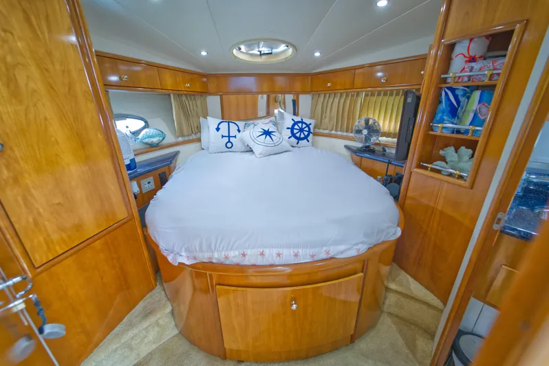  Yacht Photos Pics Luxurious cabin interior of 2002 Carver 410 Sport Sedan with nautical-themed decor.