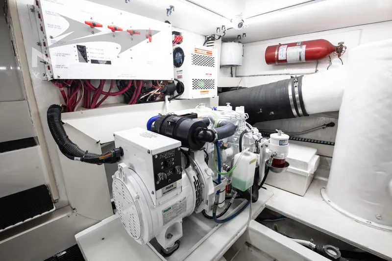 Covert Mission Yacht Photos Pics Engine room of 1998 Viking 58 Convertible yacht, featuring mechanical and electrical systems.