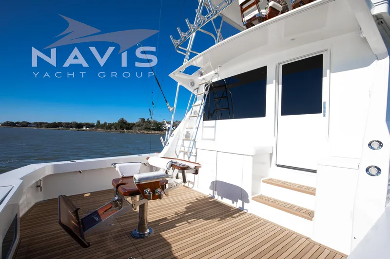 Covert Mission Yacht Photos Pics 1998 Viking 58 Convertible yacht deck with fishing chair, Navis Yacht Group branding.