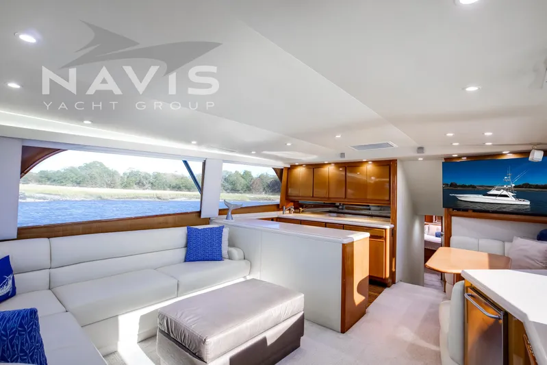 Covert Mission Yacht Photos Pics Luxurious interior of a 1998 Viking 58 Convertible yacht with modern furnishings and scenic views.