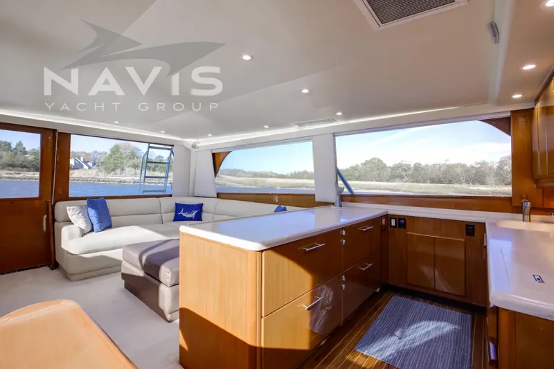 Covert Mission Yacht Photos Pics Luxurious interior of 1998 Viking 58 Convertible yacht with modern furnishings and scenic views.