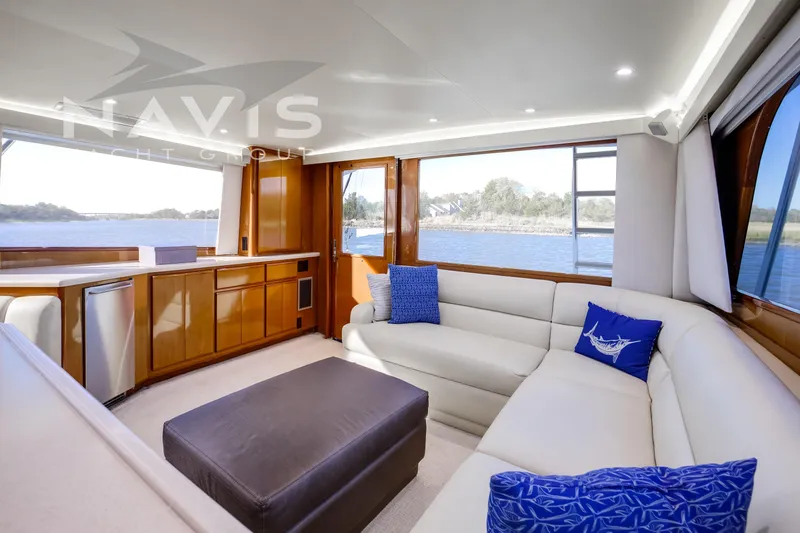 Covert Mission Yacht Photos Pics Luxurious interior of 1998 Viking 58 Convertible yacht with elegant seating and scenic water views.