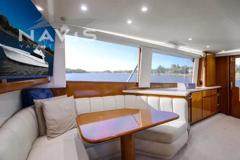 Covert Mission Yacht Photos Pics Luxurious interior of 1998 Viking 58 Convertible yacht with scenic water view.