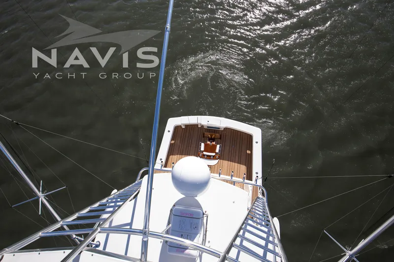 Covert Mission Yacht Photos Pics Overhead view of 1998 Viking 58 Convertible yacht on water, Navis Yacht Group branding visible.