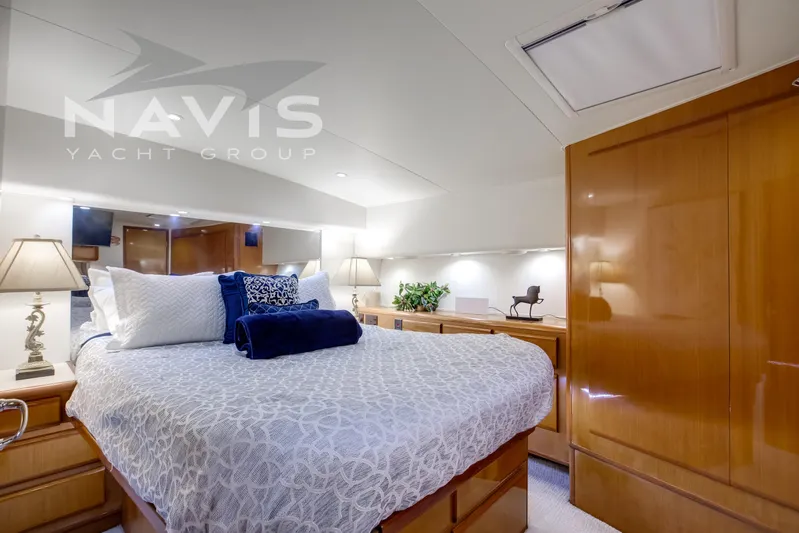 Covert Mission Yacht Photos Pics Luxurious master stateroom with elegant decor double hanging cedar closet, under bunk storage, drawers and cabinets to store everything needed for long excursions to remote destination.