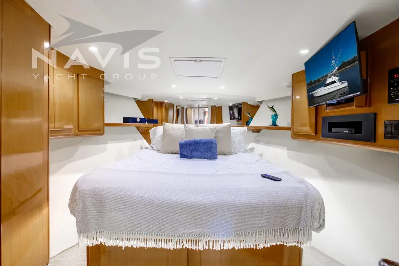 Covert Mission Yacht Photos Pics Luxurious VIP stateroom with modern amenities with under bunk storage, hanging cedar closet and other drawers and cabinets for ample storage.