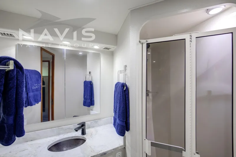 Covert Mission Yacht Photos Pics Luxurious VIP ensuite bathroom with modern fixtures.