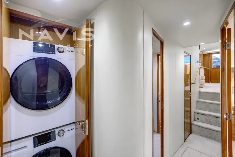 Covert Mission Yacht Photos Pics Laundry center with modern appliances and elegant interior.