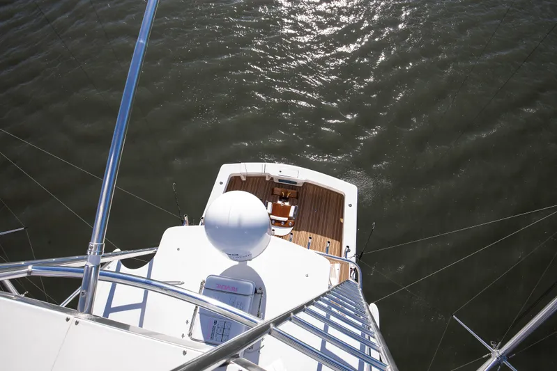 Covert Mission Yacht Photos Pics Aerial view of 1998 Viking 58 Convertible yacht deck on water.