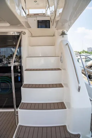  Yacht Photos Pics Staircase on 2005 Neptunus 62 Flybridge yacht, leading to upper deck.