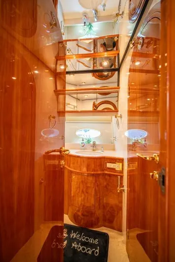  Yacht Photos Pics Luxurious 2005 Neptunus 62 Flybridge yacht interior with polished wood finishes.