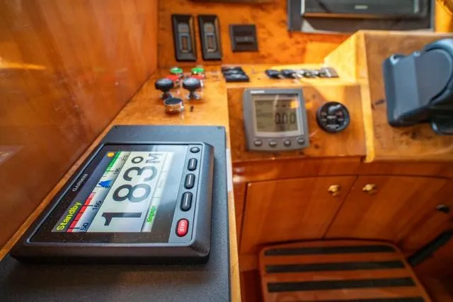  Yacht Photos Pics Neptunus 62 Flybridge 2005 yacht dashboard with navigation instruments and controls.