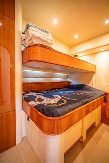  Yacht Photos Pics Luxurious cabin interior of 2005 Neptunus 62 Flybridge yacht with cozy bedding.
