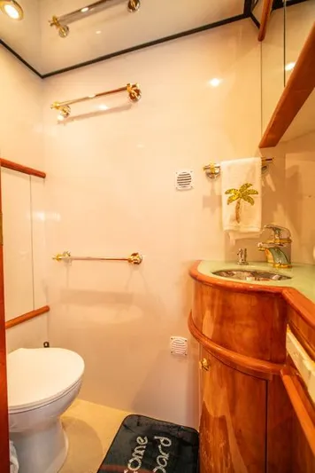  Yacht Photos Pics Luxurious bathroom in 2005 Neptunus 62 Flybridge yacht with elegant wood finishes.
