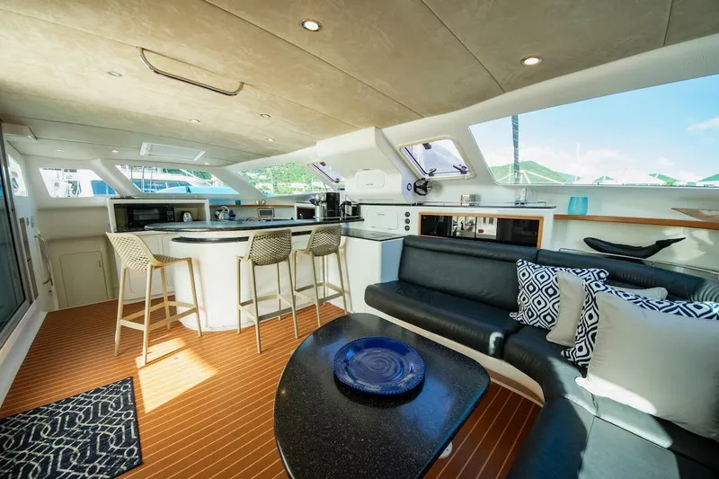 Osprey Yacht Photos Pics Luxurious interior of 2011 Voyage Yachts 520 with modern kitchen and seating area.