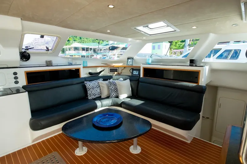 Osprey Yacht Photos Pics Luxurious interior of 2011 Voyage Yachts 520 with sleek black seating and modern decor.