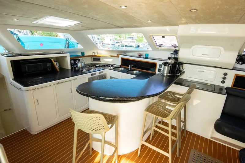 Osprey Yacht Photos Pics Luxurious kitchen interior of 2011 Voyage Yachts 520 with modern appliances and seating.