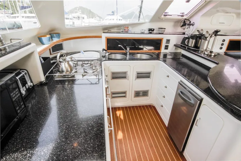 Osprey Yacht Photos Pics Luxurious kitchen interior of 2011 Voyage Yachts 520, featuring modern appliances and sleek countertops.