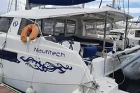 2014 Nautitech 40 Open catamaran docked, featuring sleek design and spacious deck.