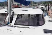 2014 Nautitech 40 Open catamaran docked at a marina, surrounded by other boats.