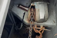 Rusty anchor chain and winch in Nautitech 40 Open 2014 yacht compartment.