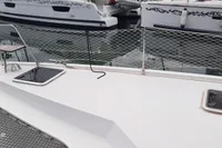 Nautitech 40 Open catamaran deck, 2014 model, docked at marina with netting and hatches.