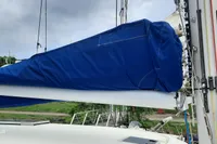 Sailboat mast and boom with blue sail cover, Nautitech 40 Open, 2014 model.