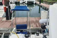 Nautitech 40 Open 2014 catamaran docked at marina with other boats.