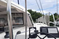 2014 Nautitech 40 Open catamaran with Garmin navigation, docked in a marina.