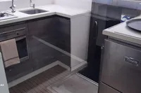Modern kitchen interior of 2014 Nautitech 40 Open yacht with appliances and sleek design.