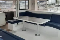Nautitech 40 Open 2014 yacht interior with blue seating and dining table.