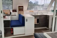 Interior of 2014 Nautitech 40 Open catamaran with modern kitchen and seating area.