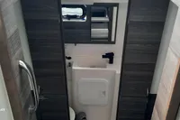 Interior bathroom of 2014 Nautitech 40 Open yacht, featuring modern fixtures and wood paneling.