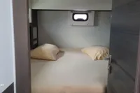 Cabin interior of 2014 Nautitech 40 Open catamaran with bed and window.